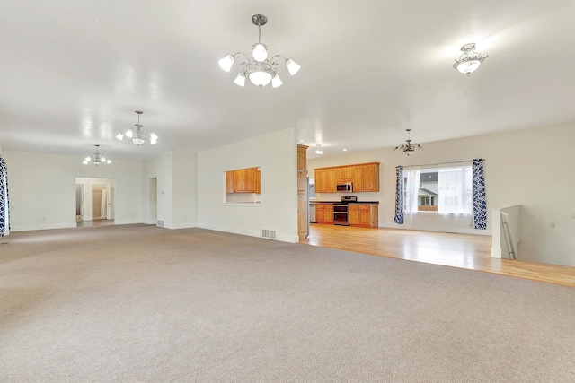 unfurnished living room with light wood-type flooring