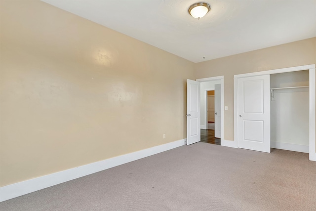 unfurnished bedroom with carpet and a closet