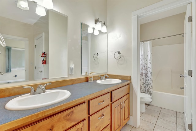 full bathroom with toilet, shower / bath combination with curtain, vanity, and tile patterned floors