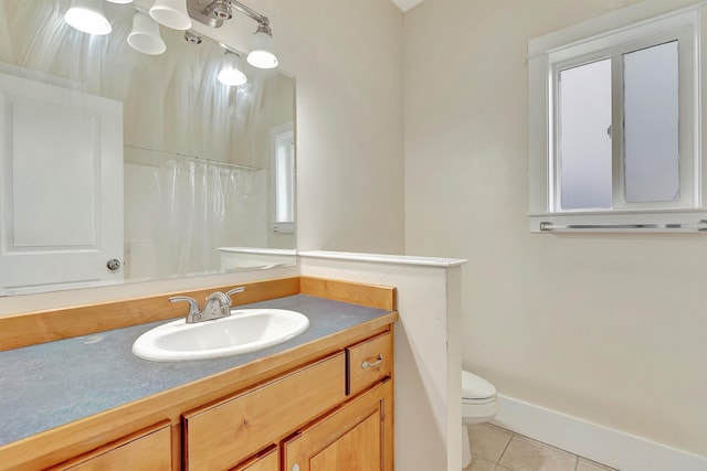 bathroom featuring tile patterned flooring, vanity, toilet, and a shower with curtain