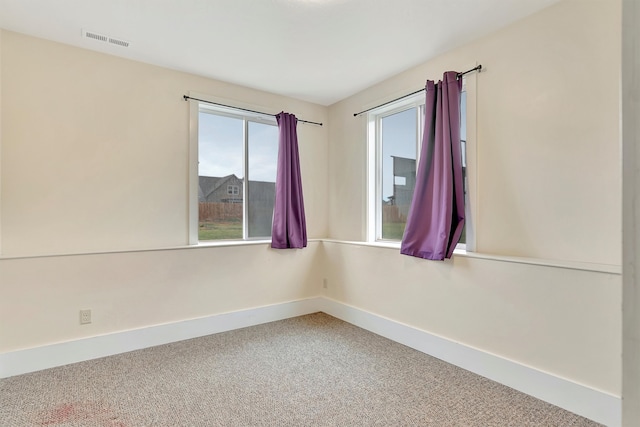 spare room featuring carpet floors