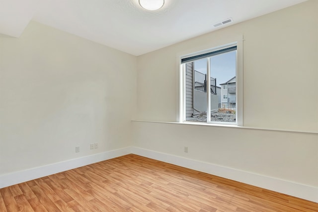 spare room with light hardwood / wood-style floors