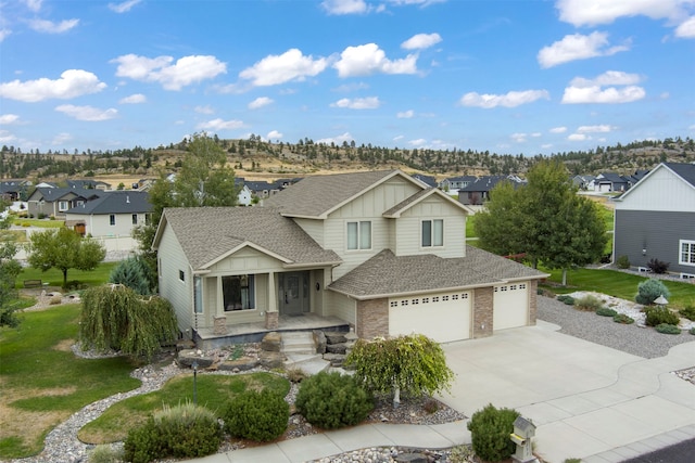 view of front of house featuring a front yard and a garage