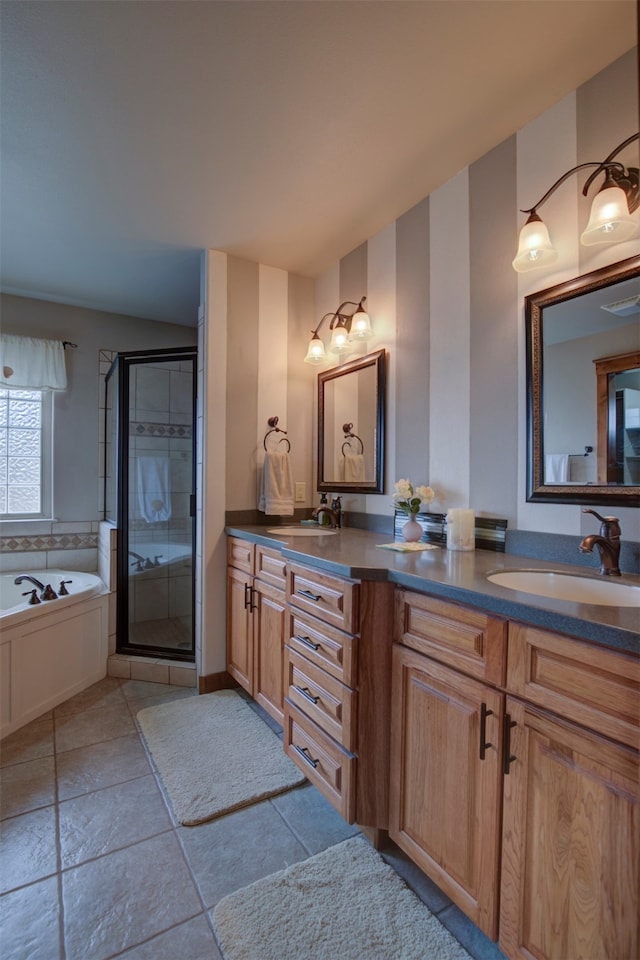 bathroom with vanity and shower with separate bathtub