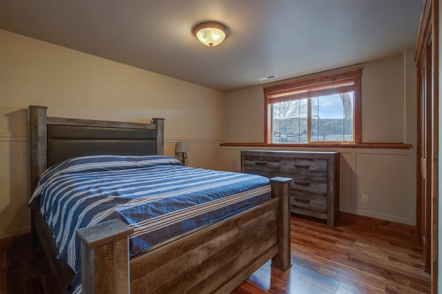 bedroom with wood-type flooring