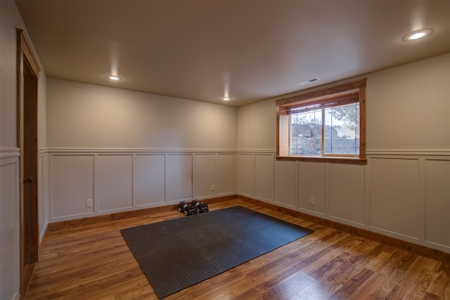 exercise area featuring wood-type flooring