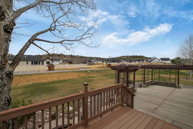 wooden terrace with a yard