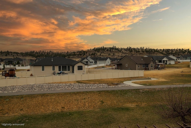 view of yard at dusk