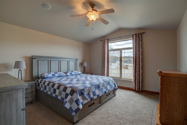 bedroom featuring ceiling fan, carpet floors, and lofted ceiling