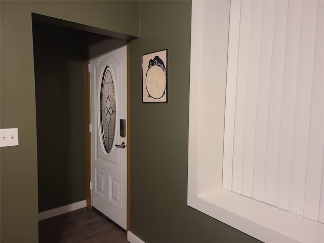 entryway with dark hardwood / wood-style floors