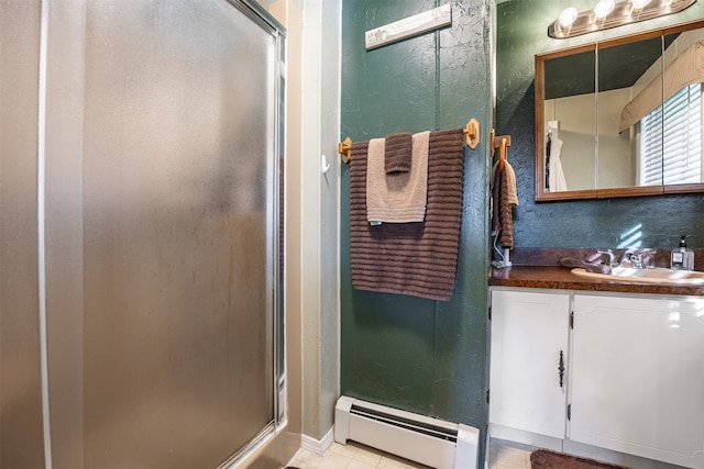 bathroom featuring tile patterned flooring, vanity, a baseboard radiator, and an enclosed shower