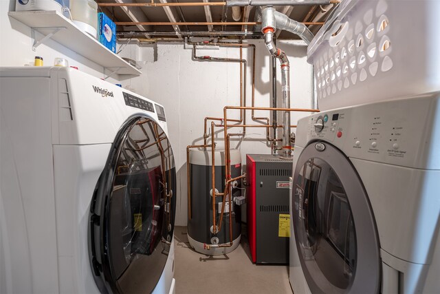 washroom featuring water heater and independent washer and dryer