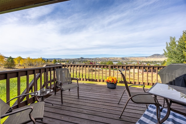 wooden terrace featuring a mountain view