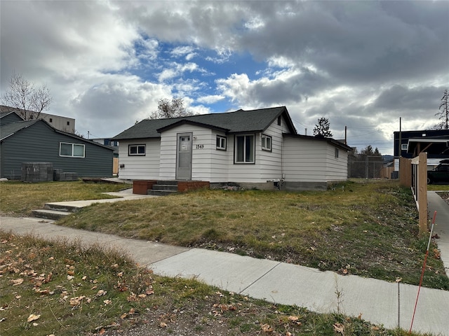 bungalow with a front yard