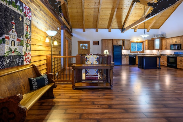 interior space featuring beam ceiling, wooden walls, dark hardwood / wood-style flooring, and high vaulted ceiling