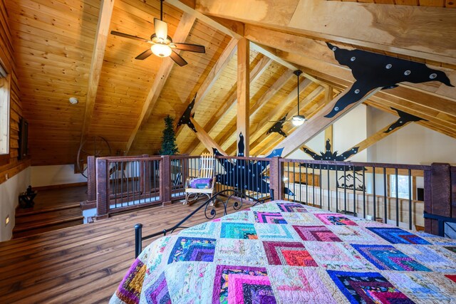 bedroom with vaulted ceiling with beams, wood-type flooring, and wood ceiling