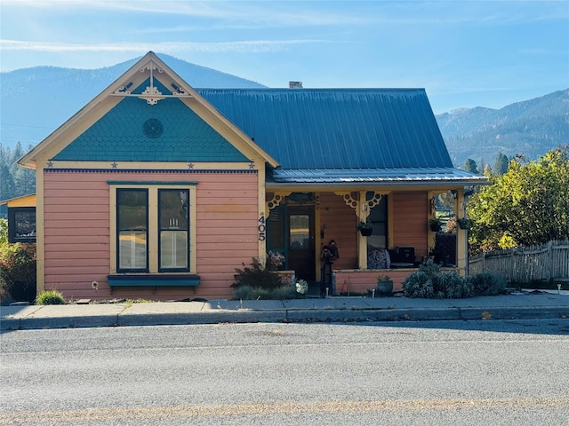 view of front of home with a mountain view and covered porch