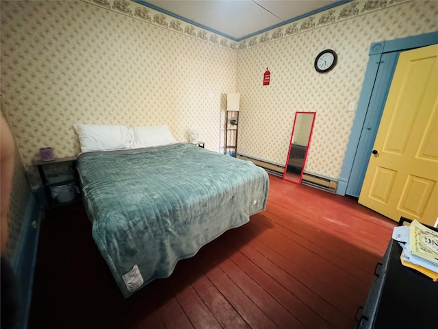 bedroom featuring dark hardwood / wood-style flooring and baseboard heating