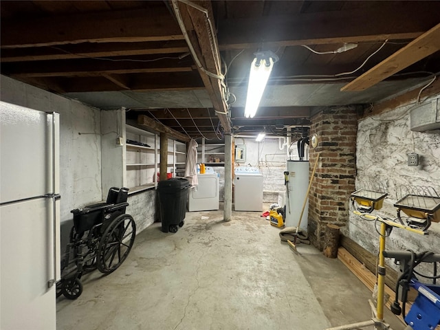 basement with water heater, white fridge, and washing machine and clothes dryer