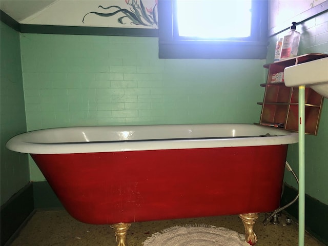 508 1st St W, Polson, MT 59860 - bathroom featuring a soaking tub and speckle patterned floor