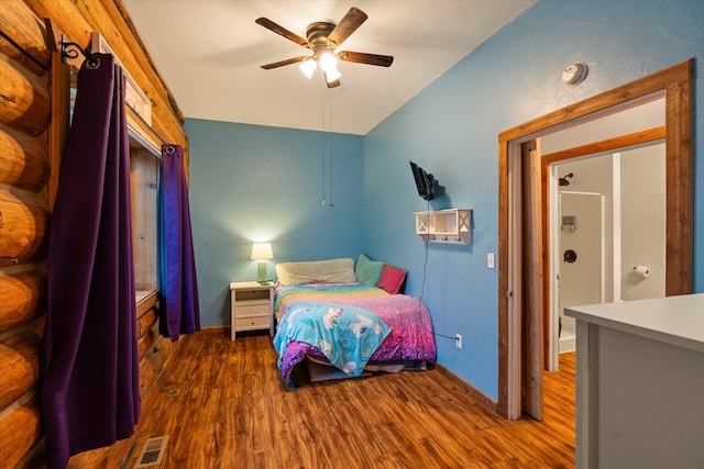 bedroom with ceiling fan and dark wood-type flooring