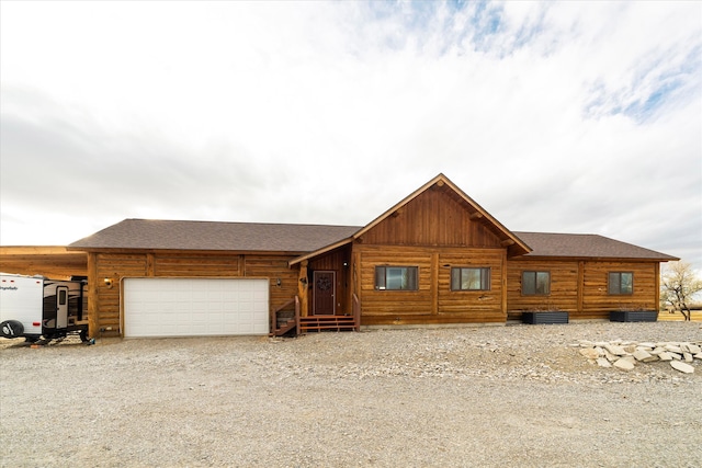 log cabin featuring a carport