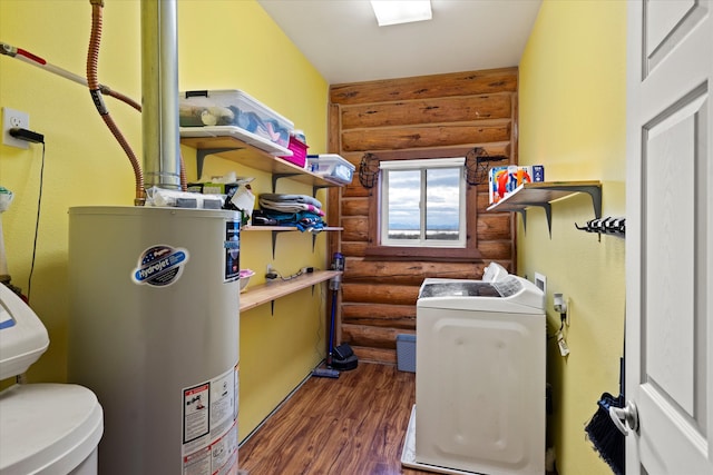 laundry room with log walls, dark hardwood / wood-style floors, and water heater