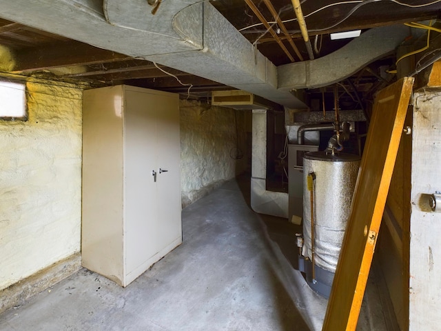 basement featuring heating unit and gas water heater