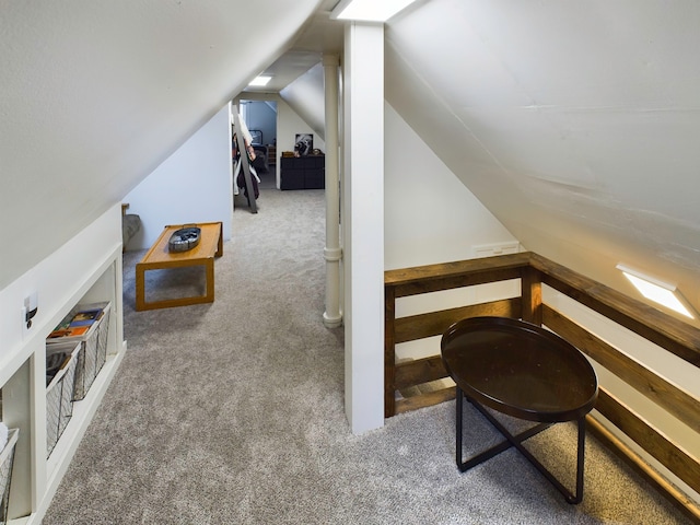 bonus room with carpet floors and lofted ceiling