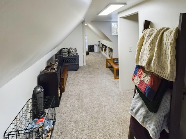 interior space featuring light colored carpet and lofted ceiling