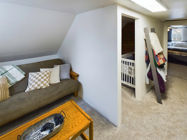 interior space featuring carpet flooring and lofted ceiling