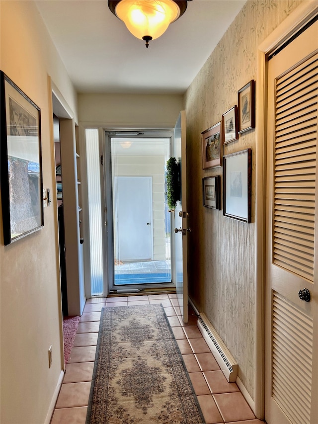 hallway featuring baseboard heating and light tile patterned floors