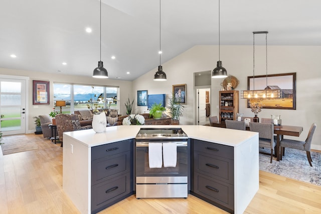 kitchen with electric stove, hanging light fixtures, light hardwood / wood-style floors, and lofted ceiling