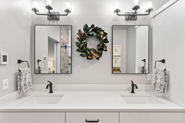 bathroom with a chandelier and vanity