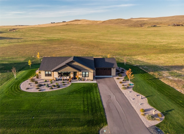 bird's eye view with a mountain view and a rural view