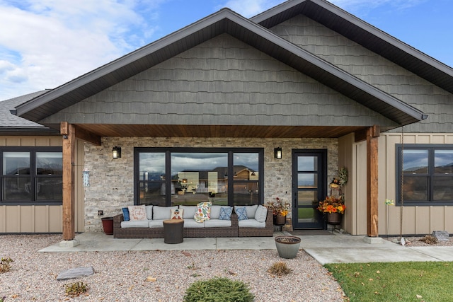 exterior space featuring an outdoor living space and a patio area