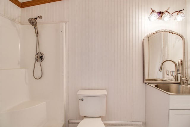 bathroom with sink, toilet, walk in shower, and wooden walls