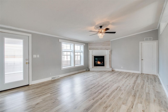 unfurnished living room featuring ceiling fan, crown molding, and light hardwood / wood-style floors