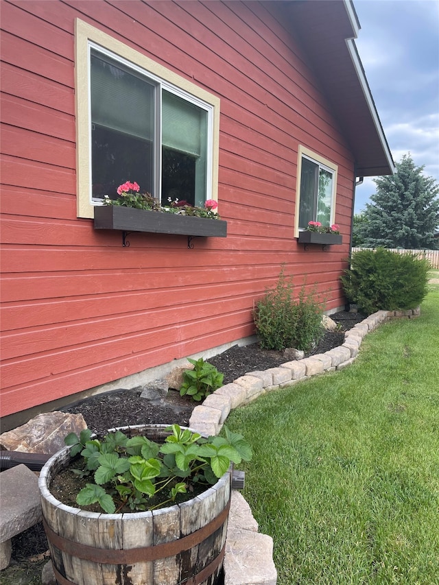 view of side of home featuring a lawn