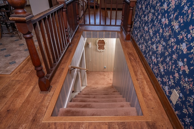 stairway featuring hardwood / wood-style floors