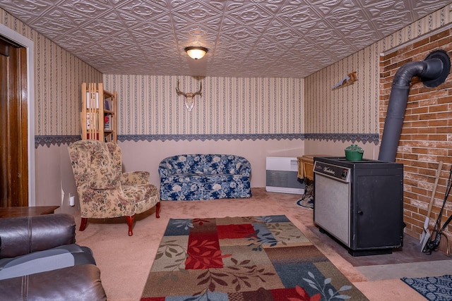 4 Courtier Rd, Thompson Falls, MT 59873 - living area with wallpapered walls, carpet, a wood stove, and an ornate ceiling