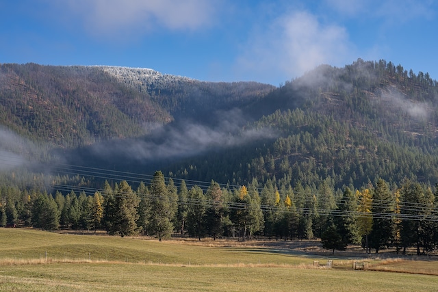 view of mountain feature with a rural view