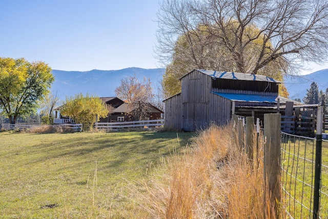 4 Courtier Rd, Thompson Falls, MT 59873 - view of yard featuring a mountain view, an outdoor structure, and a barn