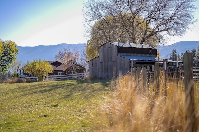 4 Courtier Rd, Thompson Falls, MT 59873 - view of yard featuring a mountain view, an outbuilding, and a barn