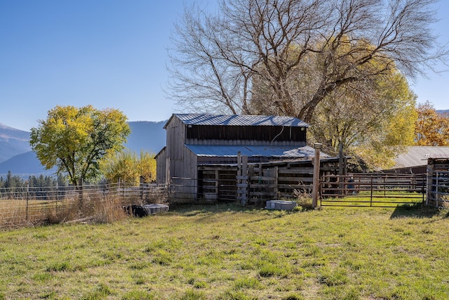 4 Courtier Rd, Thompson Falls, MT 59873 - view of yard featuring an outbuilding, a mountain view, and a pole building