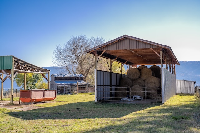 view of outdoor structure featuring a lawn