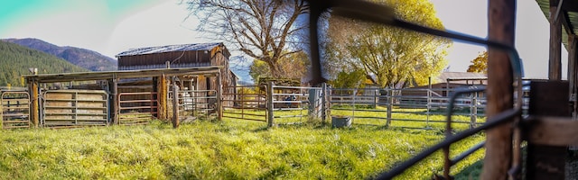 view of horse barn featuring a mountain view