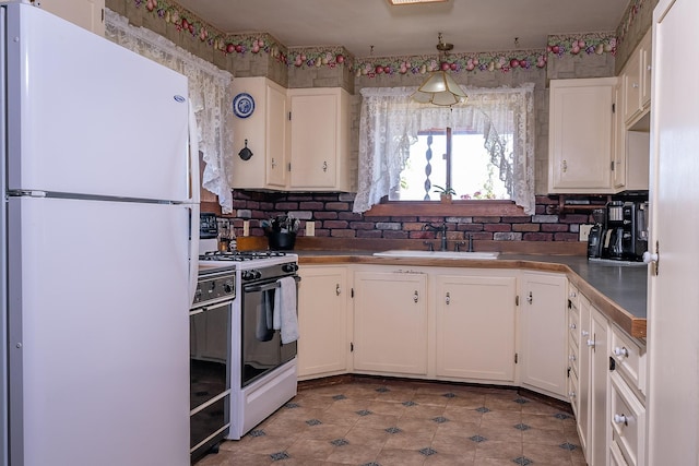4 Courtier Rd, Thompson Falls, MT 59873 - kitchen featuring white appliances, a sink, and white cabinets