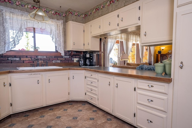 4 Courtier Rd, Thompson Falls, MT 59873 - kitchen featuring a sink, white cabinets, tile patterned floors, and dark countertops