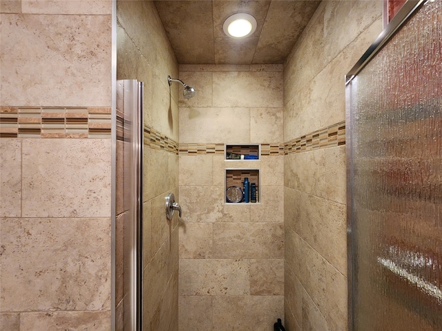 bathroom featuring an enclosed shower